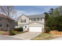 Charming two-story home with a well-manicured lawn and a two-car garage at 1924 Sweet Flag Rd, Lawrenceville, GA 30045