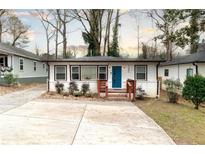 Charming single-story home with a bright blue front door and a cozy, inviting entrance at 1486 Akridge Nw St, Atlanta, GA 30314