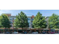 Attractive, low-rise building with street-level retail and lush mature trees lining the facade at 225 E Ponce De Leon Ave # 317, Decatur, GA 30030
