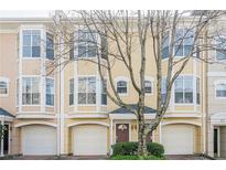 Charming townhome featuring bay windows, brick driveway, and attached one car garage at 375 Highland Ne Ave # 903, Atlanta, GA 30312