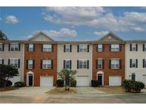 Charming townhome featuring brick accents, and private garage at 5364 Hickory Knl, Norcross, GA 30071