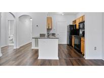 Bright kitchen featuring stainless steel appliances, granite countertops, and dark wood floors at 4333 Dunwoody Park # 1211, Atlanta, GA 30338