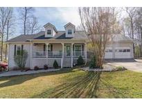 Charming single-Gathering home with a welcoming front porch and attached two-car garage at 103 New Hood Rd, Stockbridge, GA 30281