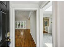 Inviting entryway showcasing hardwood floors and bright natural light, leading to an open living space at 1323 Christmas Ne Ln, Atlanta, GA 30329