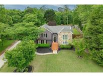 Charming two-story home with stone accents, landscaped lawn, and inviting entryway steps at 434 Shepard Sw Dr, Marietta, GA 30064