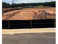 A developing empty lot displaying ongoing construction with level land ready for future building projects at 6357 Towhee Way, Morrow, GA 30260