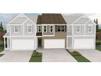 Inviting two-story townhome showcasing stone and gray siding with a two-car garage at 6359 Towhee Way, Morrow, GA 30260
