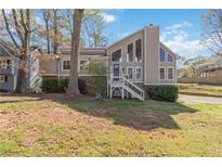 Charming home featuring a stone foundation and a modern entrance with large windows at 2730 Interlaken Dr, Marietta, GA 30062