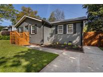 Charming home with painted brick, dark shutters, and a new wooden porch at 2189 Gordon Se Cir, Smyrna, GA 30080