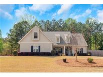 Charming single-Gathering home features a well-maintained front yard and classic architectural details at 20 Saddle Wood Dr, Dallas, GA 30157