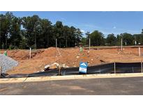 Available land lot featuring utility hookups ready for new construction in a treed community at 6354 Towhee Way, Morrow, GA 30260