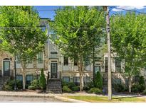 Charming townhome exterior with brick facade and manicured landscaping creating inviting curb appeal at 709 Bismark Ne Rd, Atlanta, GA 30324