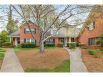 Charming brick townhouse with well-maintained landscaping and inviting walkways at 3264 Henderson Mill Rd # C, Atlanta, GA 30341
