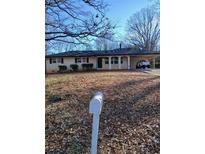 Charming single-story home featuring a covered parking area and a well-maintained front yard at 4985 Doby Ln, Austell, GA 30106