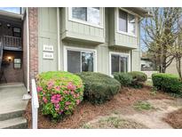 Inviting exterior of a two story building with well-maintained landscaping and blooming azaleas at 2112 Palmyra Dr, Marietta, GA 30067
