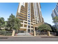 High-rise condo building with a gated entrance, professionally landscaped surroundings, and beautiful balconies at 3481 Lakeside Ne Dr # 2203, Atlanta, GA 30326
