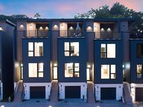 Modern townhome exterior featuring private balconies, attached garages, and stylish architectural details at 1570 Flat Shoals Se Rd # 4, Atlanta, GA 30316