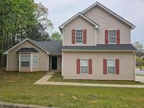 Charming two-story home with red shutters and a well-maintained front yard at 3763 Waldrop Hills Dr, Decatur, GA 30034