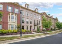 Charming townhomes with brick facades, manicured landscaping and inviting curb appeal at 402 River Vista Dr, Atlanta, GA 30339
