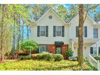 Charming two-story home with well-maintained landscaping and a welcoming front entrance at 3075 Camden Way, Alpharetta, GA 30005