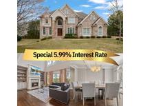 Elegant stone home with a manicured lawn and inviting facade at 4402 Income Cir, Ellenwood, GA 30294