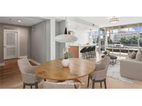 Bright and airy living room featuring an open floor plan and a modern dining area with city views at 250 Park Avenue West Nw # 313, Atlanta, GA 30313