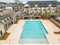Community pool with lounge areas and well-maintained surroundings at 3980 Allegretto Cir, Atlanta, GA 30339