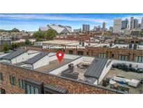 Relaxing rooftop deck with outdoor seating and skyline views, perfect for entertaining guests at 267 Castleberry Station Sw Dr, Atlanta, GA 30313