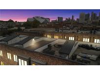 Modern rooftop deck with outdoor seating and city views, perfect for entertaining or relaxing under the Atlanta skyline at 267 Castleberry Station Sw Dr, Atlanta, GA 30313