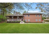 Charming two-story home with a welcoming front porch and well-manicured lawn at 3916 S Martin Way, Lithia Springs, GA 30122