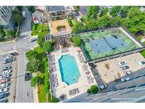Overhead view showcasing the pool, tennis court, parking, and surrounding community at 325 E Paces Ferry Ne Rd # 1405, Atlanta, GA 30305