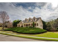 Charming two-story home featuring a well-manicured lawn and a welcoming front porch at 300 Maple Grove Ct, Canton, GA 30114