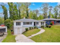 Charming home featuring a landscaped front yard and welcoming entrance at 111 Leathers Circle Nw, Atlanta, GA 30314