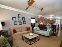 Comfortable living room featuring an open layout with modern lighting and a cozy seating area at 62 Emerson Hill Sq, Marietta, GA 30060