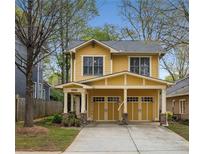 Charming two-story home with a welcoming front porch and well-manicured lawn at 357 Murray Hill Ne Ave, Atlanta, GA 30317