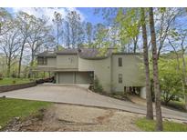 Unique, multi-level home featuring a two-car garage and a natural setting at 1670 Nordic Trce, Marietta, GA 30068