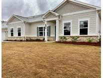 Charming single-story home with neutral siding, brick accents and a well-manicured lawn at 3904 Shelleydale Dr, Powder Springs, GA 30127