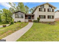 Charming two-story home with a landscaped front yard and inviting entrance at 5429 Golfcrest Cir, Stone Mountain, GA 30088