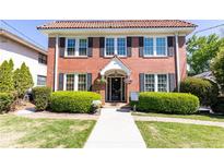 Charming two-story brick home with manicured landscaping and a welcoming front entrance at 824 Greenwood Ne Ave # 9, Atlanta, GA 30306