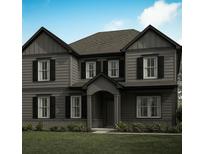 Charming two-story home featuring a well-manicured lawn, gray siding, and classic black shutters at 2740 Byess Ct, Marietta, GA 30064
