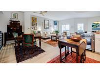 Bright living room featuring hardwood floors, a dining area, and large windows with lots of natural light at 587 Virginia Ne Ave # 314, Atlanta, GA 30306