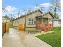 Charming single-story home featuring a covered front porch, updated siding, concrete driveway, and a well-manicured lawn at 1716 Browning Sw St, Atlanta, GA 30314