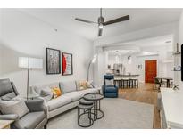 Bright living room features modern furnishings, neutral colors, ceiling fan and an open floor plan at 200 River Vista Dr # 713, Atlanta, GA 30339