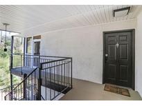 Exterior entryway featuring a black front door with a decorative knocker and a 'Home Sweet Home' welcome mat at 1445 Monroe Ne Dr # C6, Atlanta, GA 30324