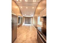 Bright kitchen featuring stainless steel appliances, granite countertops, and tiled floors at 2949 Westbury Dr, Decatur, GA 30033