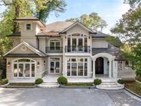 Stunning two-story home with a grand entrance, balcony, and manicured landscaping at 3511 Roxboro Ne Rd, Atlanta, GA 30326