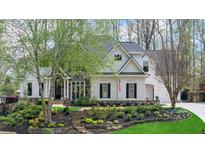 Charming two-story home with manicured front yard, stone steps, and flowering trees at 2305 Whiting Bay Cts, Kennesaw, GA 30152