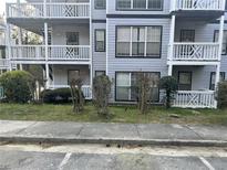 Apartment building featuring balconies and well-maintained landscaping at 3518 Shepherds Path, Decatur, GA 30034