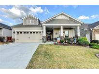 Charming home with a well-maintained front lawn and a welcoming front porch with classic columns at 230 Hickory Chase, Canton, GA 30115