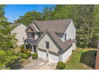 Two-story home featuring a neutral exterior, complemented by an attached two-car garage at 818 Prada Ct, Lawrenceville, GA 30043